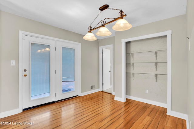 unfurnished dining area with light hardwood / wood-style floors