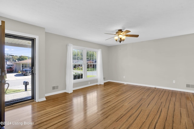 unfurnished room featuring light hardwood / wood-style flooring and ceiling fan