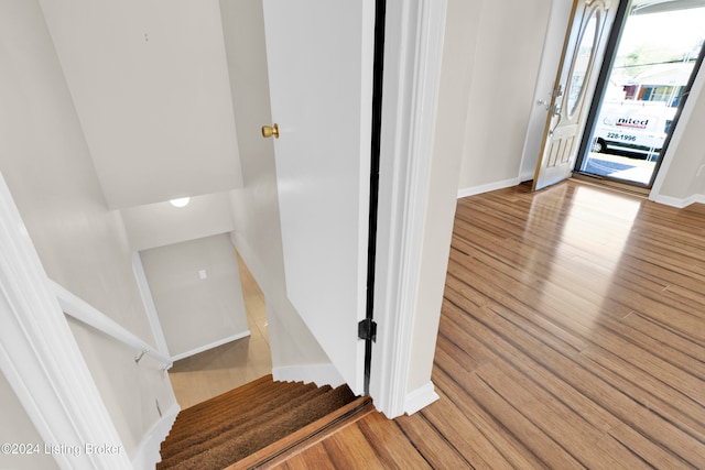 staircase featuring hardwood / wood-style floors