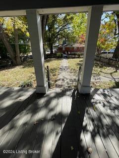 827 W Florence Ave, Louisville, KY 40215 - wooden terrace featuring covered porch and fence