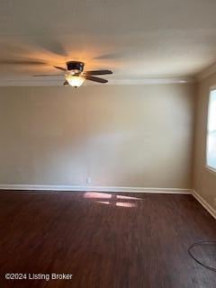 spare room with crown molding, ceiling fan, and dark hardwood / wood-style flooring