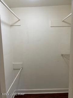 827 W Florence Ave, Louisville, KY 40215 - walk in closet featuring dark wood-style floors