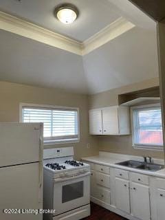 kitchen featuring sink, crown molding, white cabinetry, and white appliances