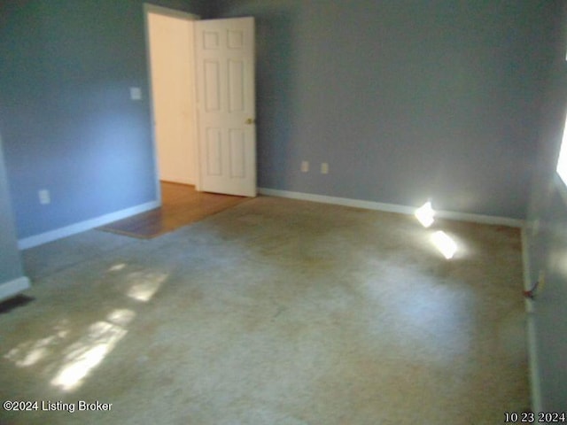 empty room with dark carpet