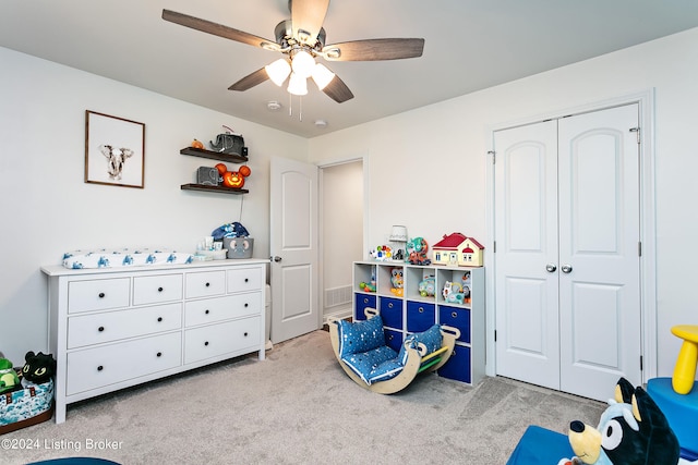 rec room featuring light colored carpet and ceiling fan