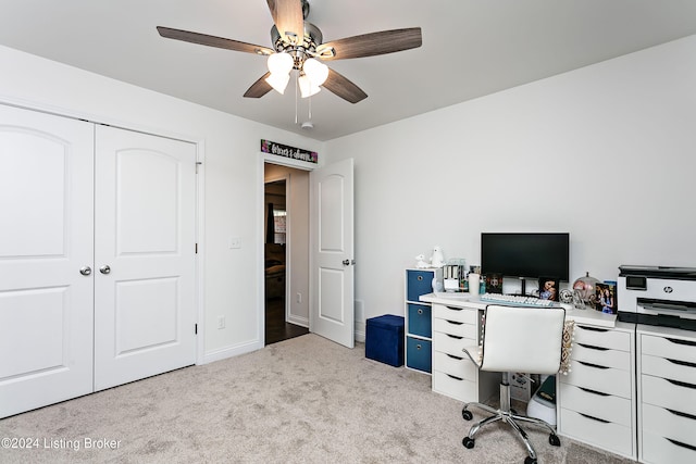 office space with light carpet and ceiling fan