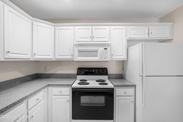 kitchen with white cabinetry and white appliances