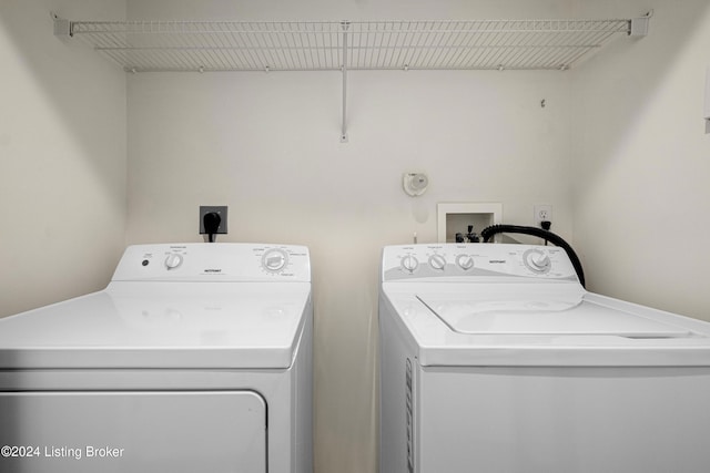 washroom featuring independent washer and dryer