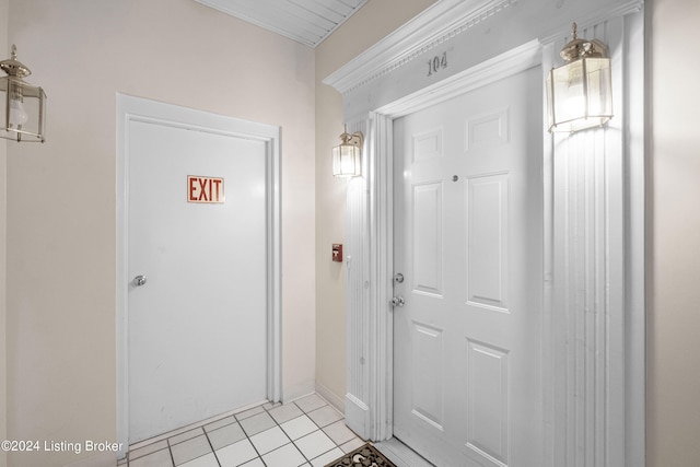 doorway featuring light tile patterned flooring