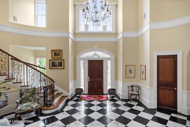 entrance foyer featuring a notable chandelier and a high ceiling