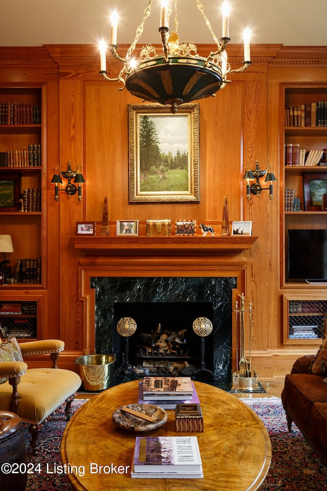 living room featuring wood walls and built in features