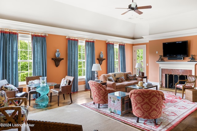 living room featuring ceiling fan, vaulted ceiling, and hardwood / wood-style floors