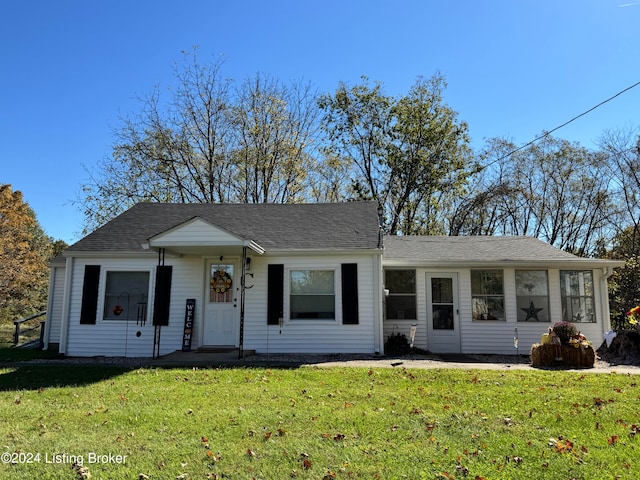 ranch-style home with a front lawn