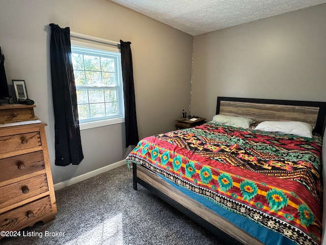 bedroom featuring a textured ceiling