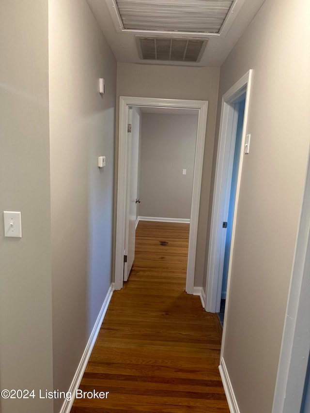 hall with dark wood-type flooring