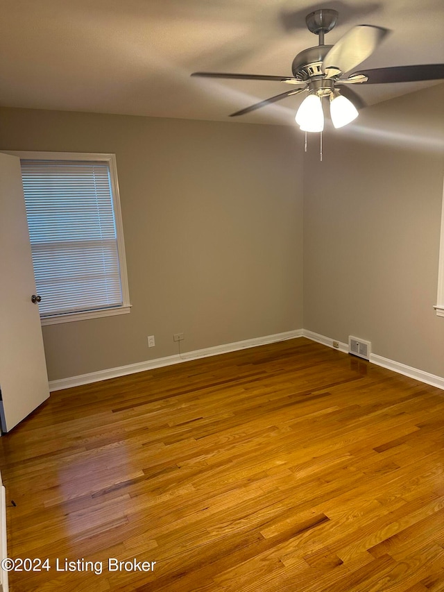 spare room with light hardwood / wood-style floors and ceiling fan