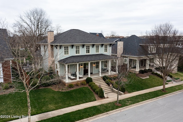 view of front of house featuring a porch and a front lawn