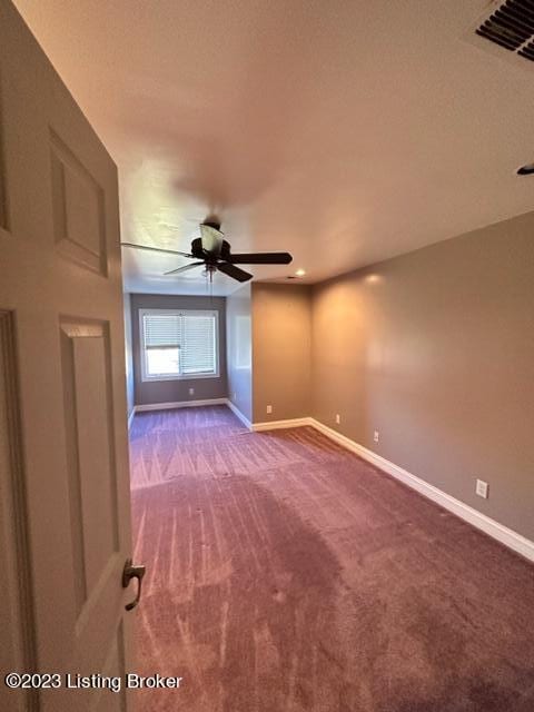 empty room with carpet floors and ceiling fan