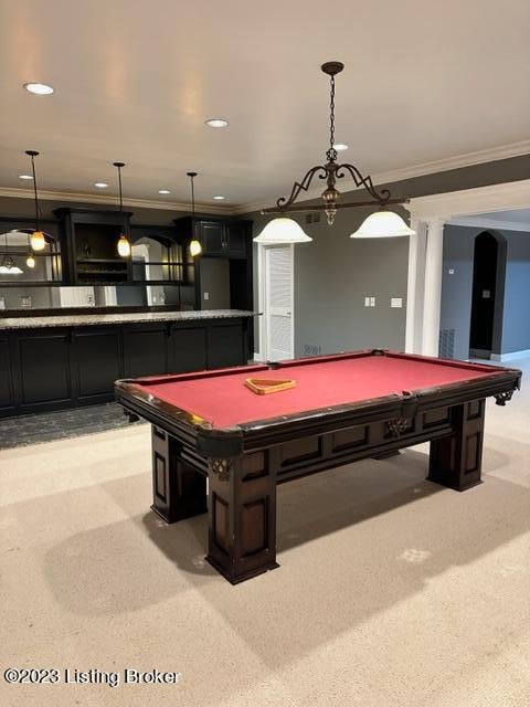 game room with crown molding, light carpet, and indoor bar