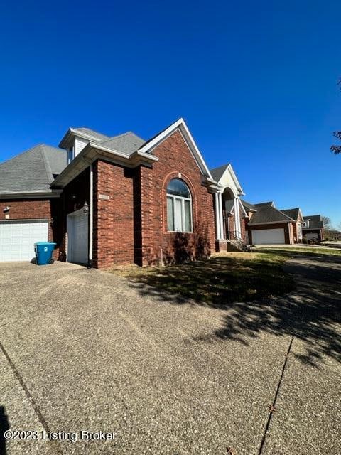 single story home featuring a garage