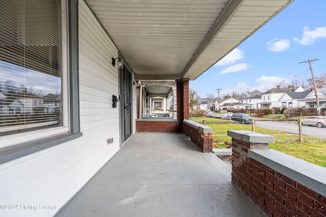 view of patio featuring a porch