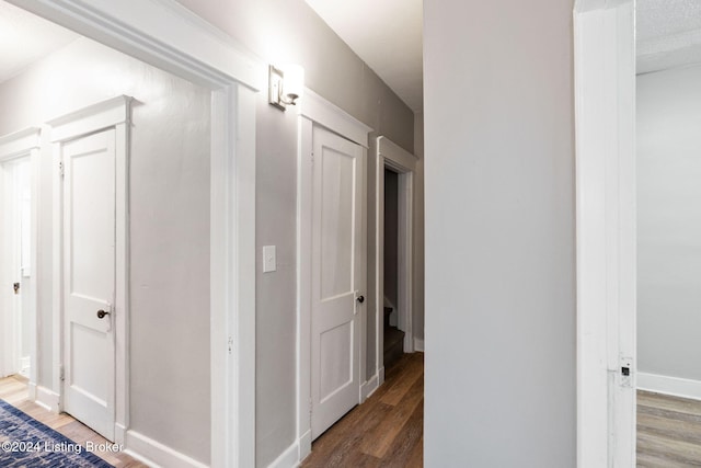 hall featuring wood-type flooring