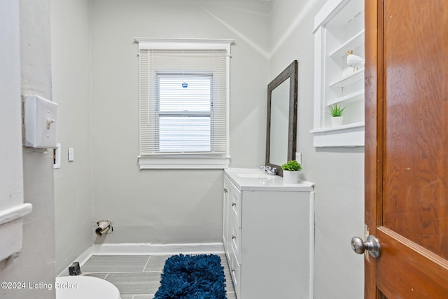 bathroom featuring vanity and toilet