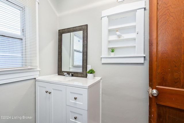 bathroom featuring vanity and a healthy amount of sunlight