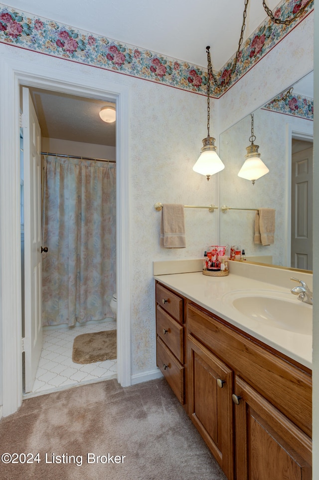 bathroom with vanity and toilet