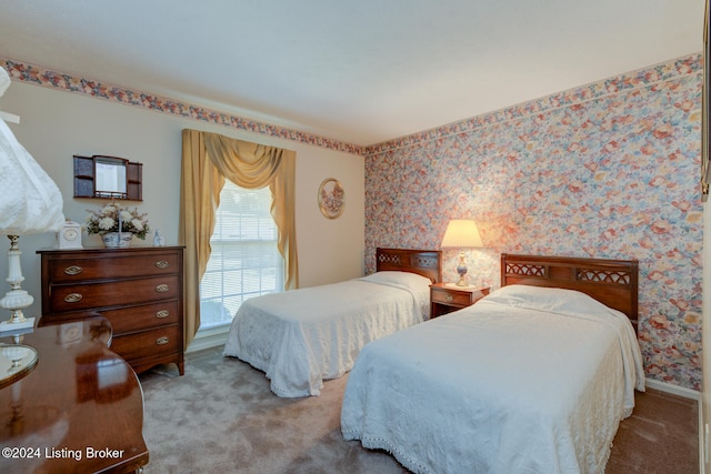 bedroom featuring light carpet