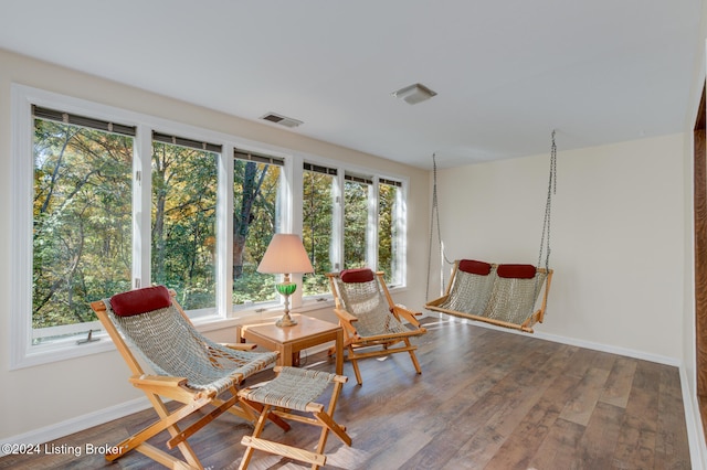 living area featuring hardwood / wood-style flooring and plenty of natural light