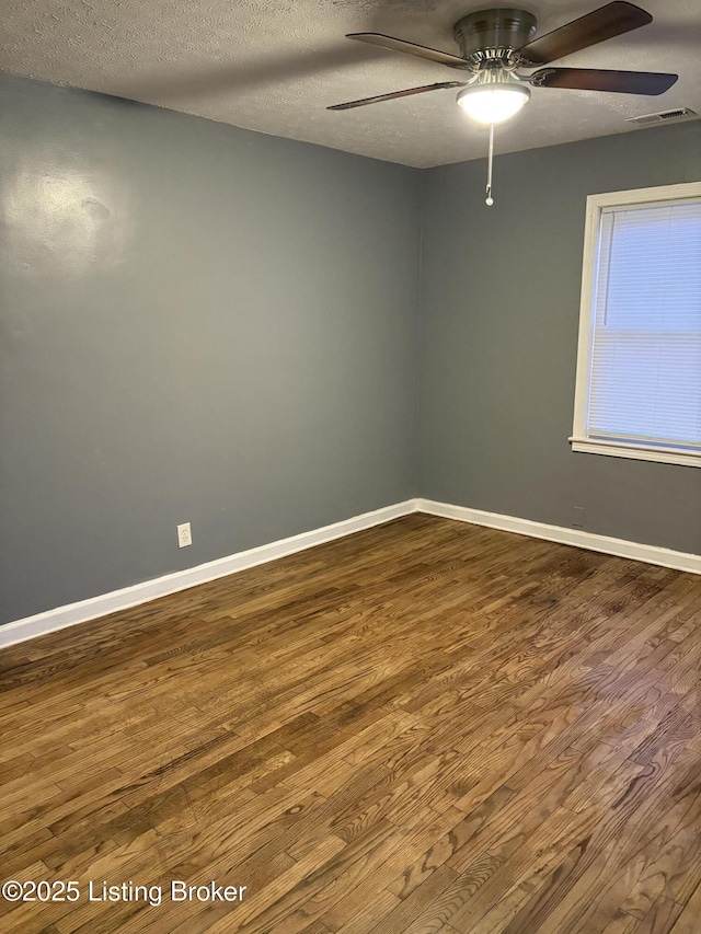 unfurnished room featuring ceiling fan, a textured ceiling, and hardwood / wood-style floors