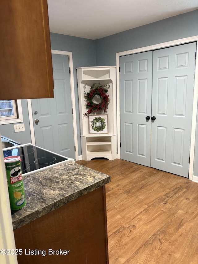 kitchen featuring stove and light wood-type flooring