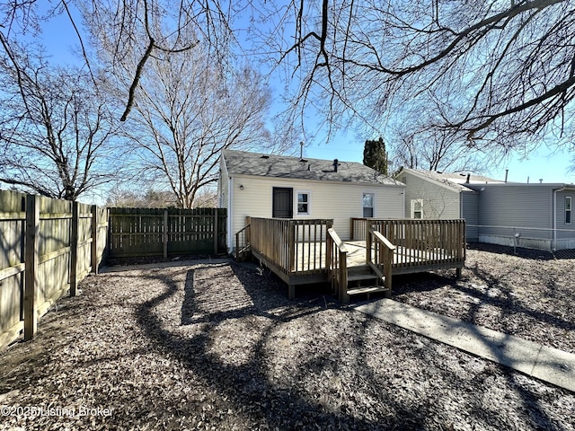 back of property with a wooden deck