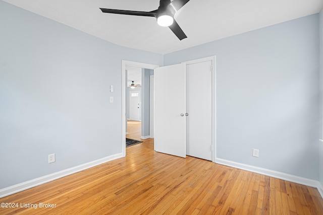 unfurnished bedroom with light wood-type flooring and ceiling fan