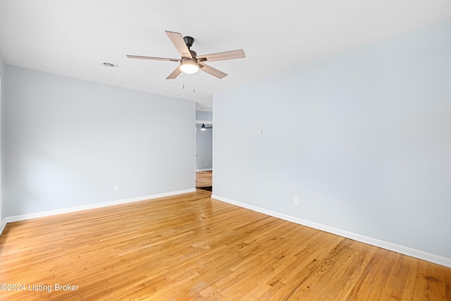 unfurnished room featuring light wood-type flooring and ceiling fan