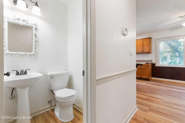 bathroom featuring toilet, hardwood / wood-style flooring, and sink