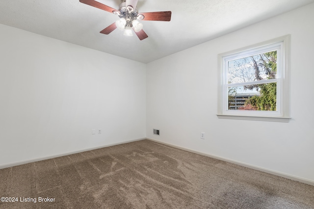 carpeted empty room with ceiling fan