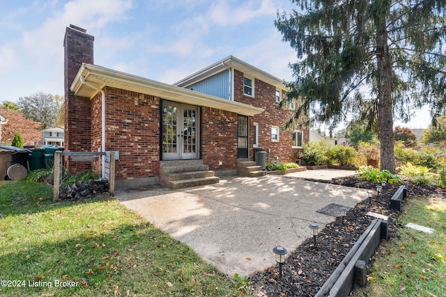 rear view of property featuring a patio area and central AC unit