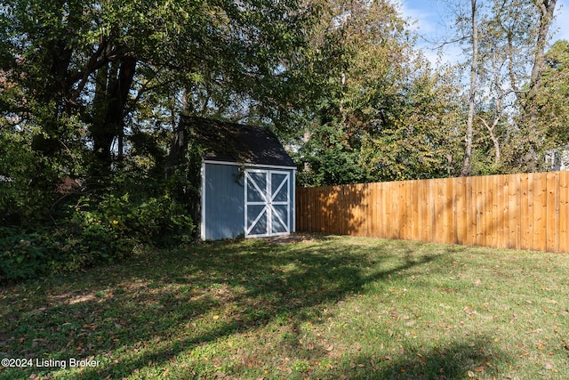 view of outdoor structure featuring a lawn