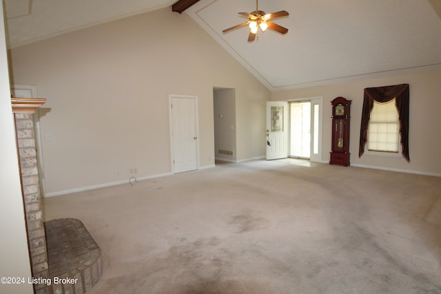 unfurnished living room featuring light colored carpet, beam ceiling, high vaulted ceiling, and ceiling fan