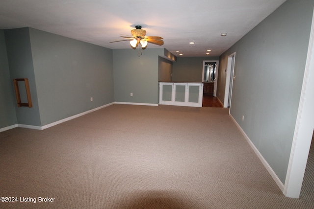 carpeted empty room with ceiling fan