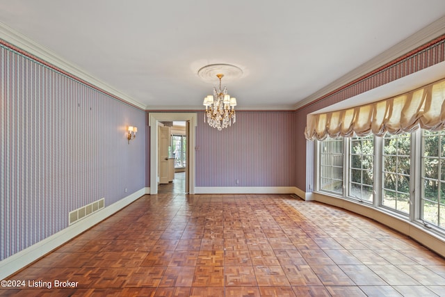 unfurnished room with an inviting chandelier, a wealth of natural light, parquet flooring, and crown molding