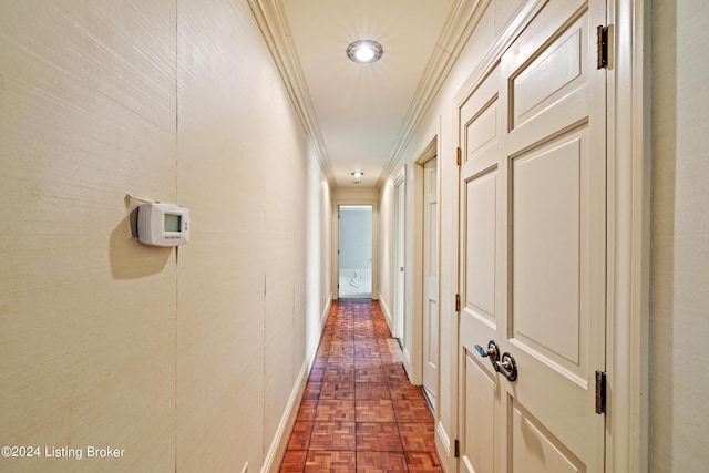 corridor with ornamental molding and dark parquet floors