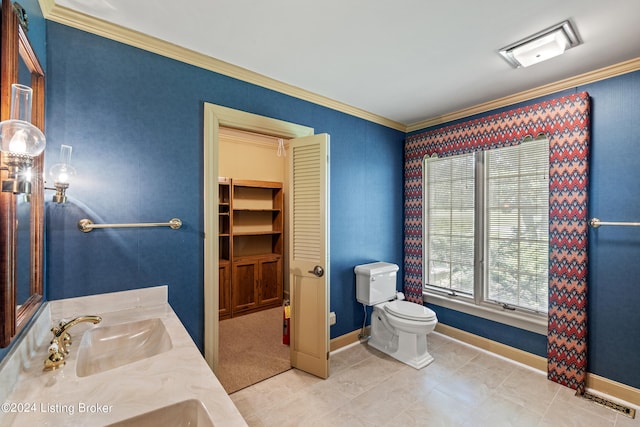 bathroom featuring ornamental molding, toilet, and vanity