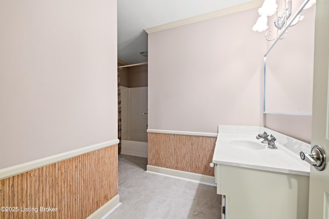 bathroom with vanity, bathtub / shower combination, and wood walls