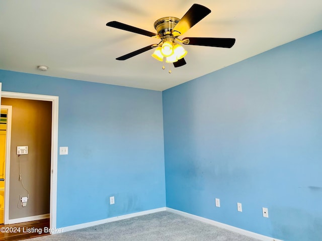 carpeted empty room with ceiling fan