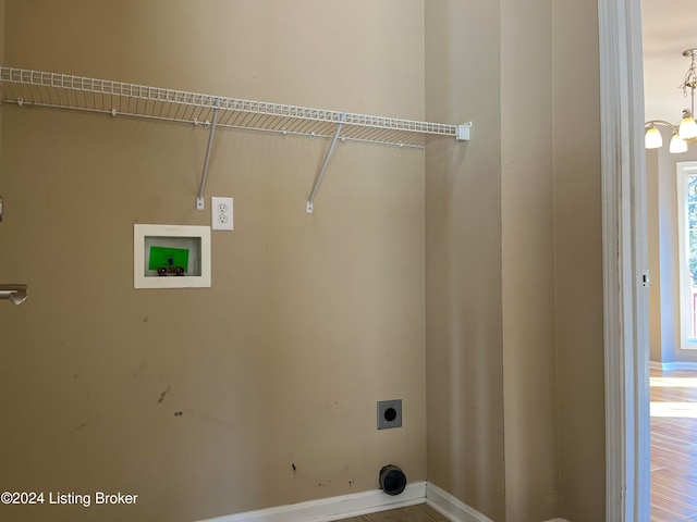 laundry area with hookup for an electric dryer, wood-type flooring, and hookup for a washing machine