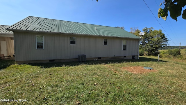 exterior space featuring a yard and central AC unit