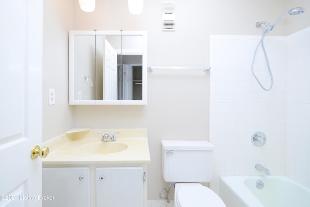 full bathroom featuring vanity, toilet, and tiled shower / bath